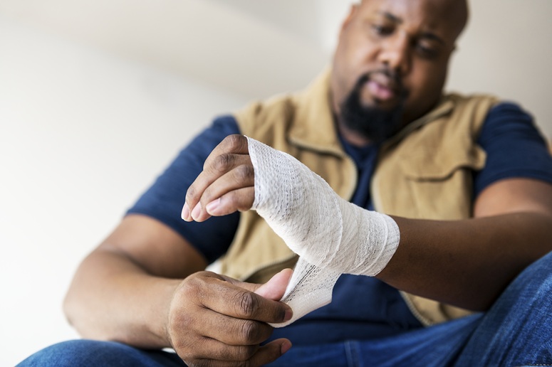 man with injured wrist