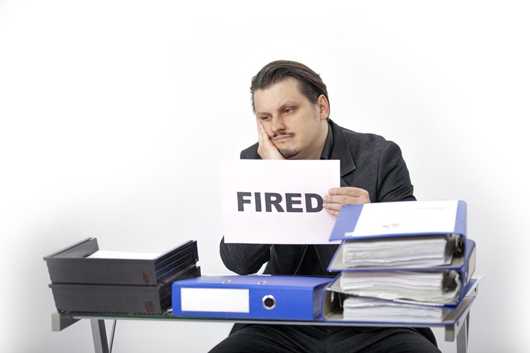 man holding fired sign