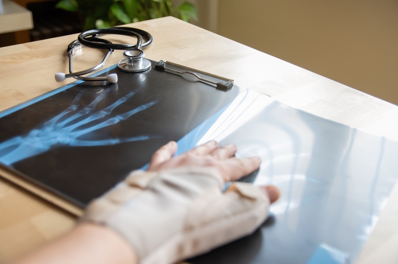 Doctor reviewing medical records for a workers’ compensation case in Ohio