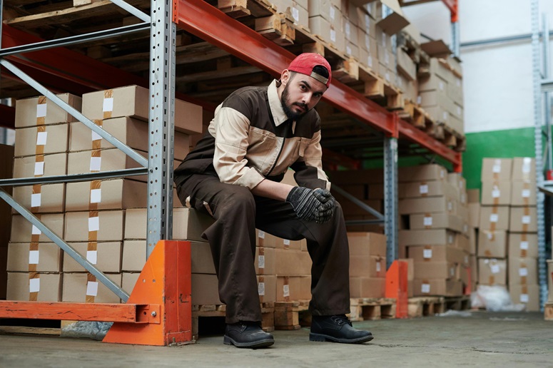 Worker sitting on a pallet
