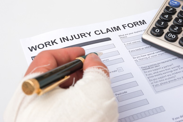 Injured worker reviewing a workers’ compensation settlement offer in Ohio