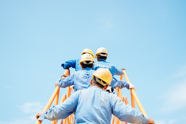Construction workers on a ladder